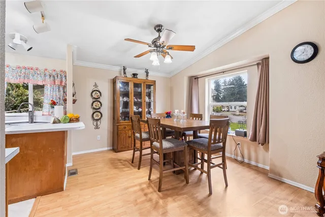 a view of a dining room with furniture window and wooden floor