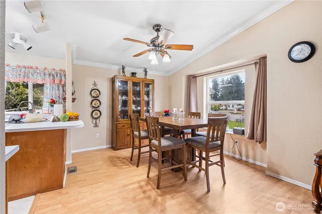a view of a dining room with furniture window and wooden floor