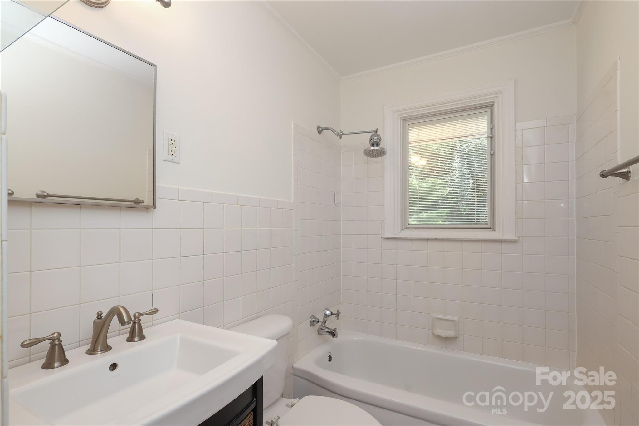 4361 Applegate Road Charlotte, NC 28209 - Photo 11 of 17 a bathroom with a sink and a bathtub