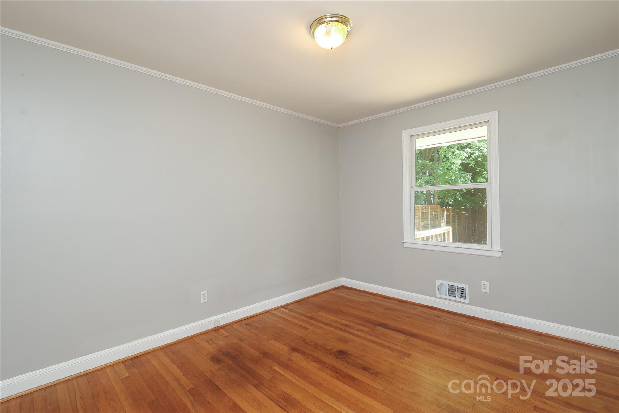 4361 Applegate Road Charlotte, NC 28209 - Photo 13 of 17 an empty room with a window