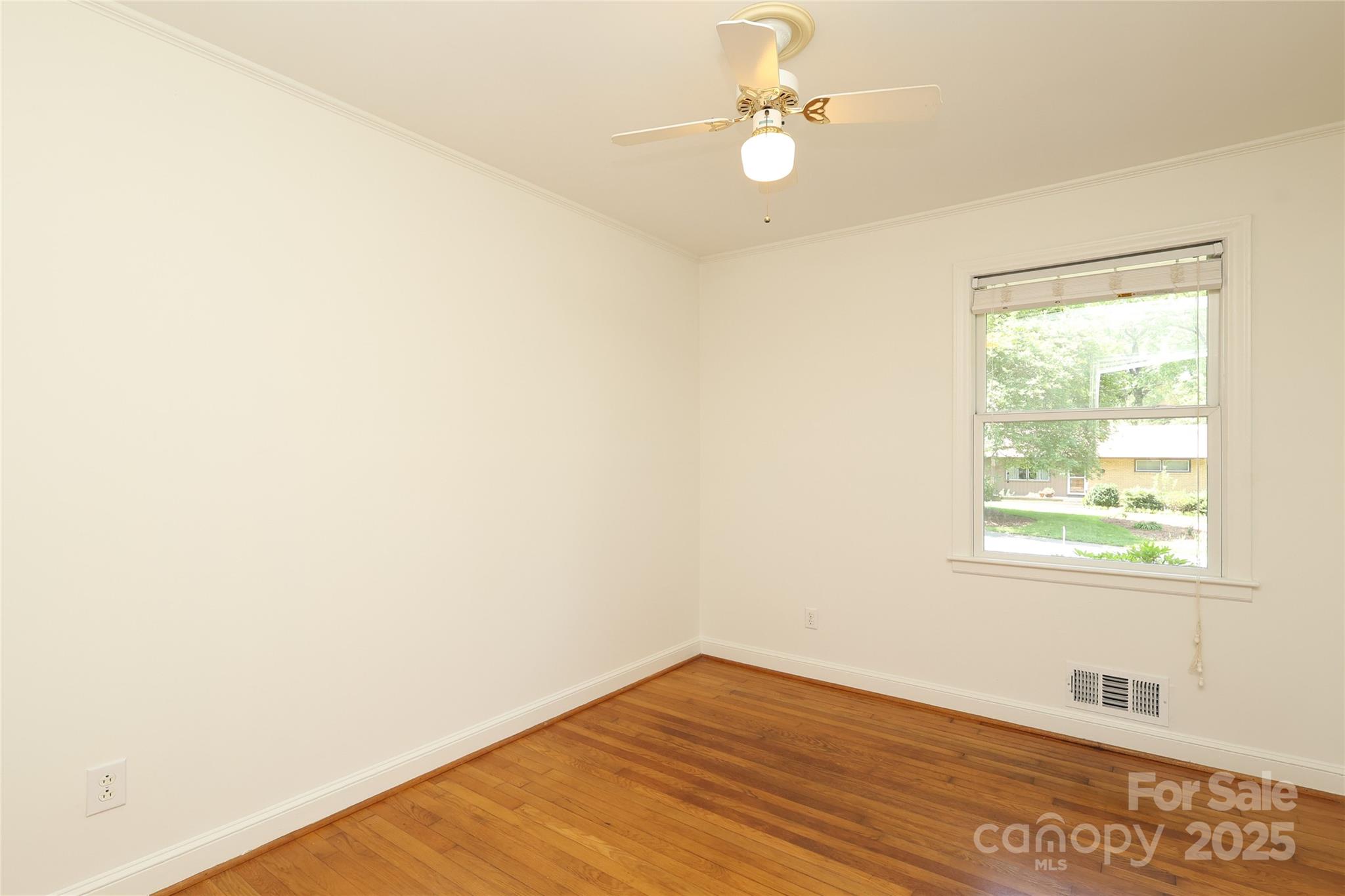 4361 Applegate Road Charlotte, NC 28209 - Photo 14 of 17 an empty room with a window
