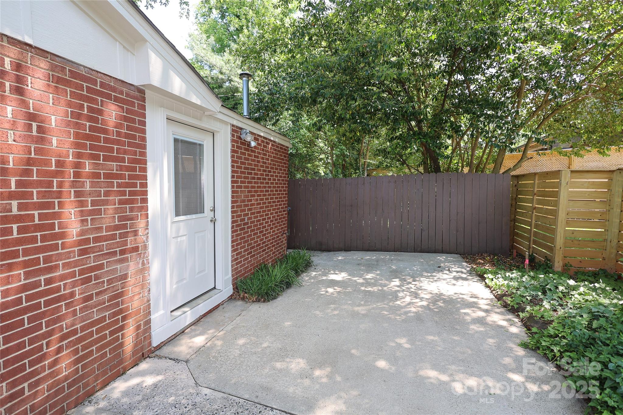 4361 Applegate Road Charlotte, NC 28209 - Photo 15 of 17 a view of small white building with large trees