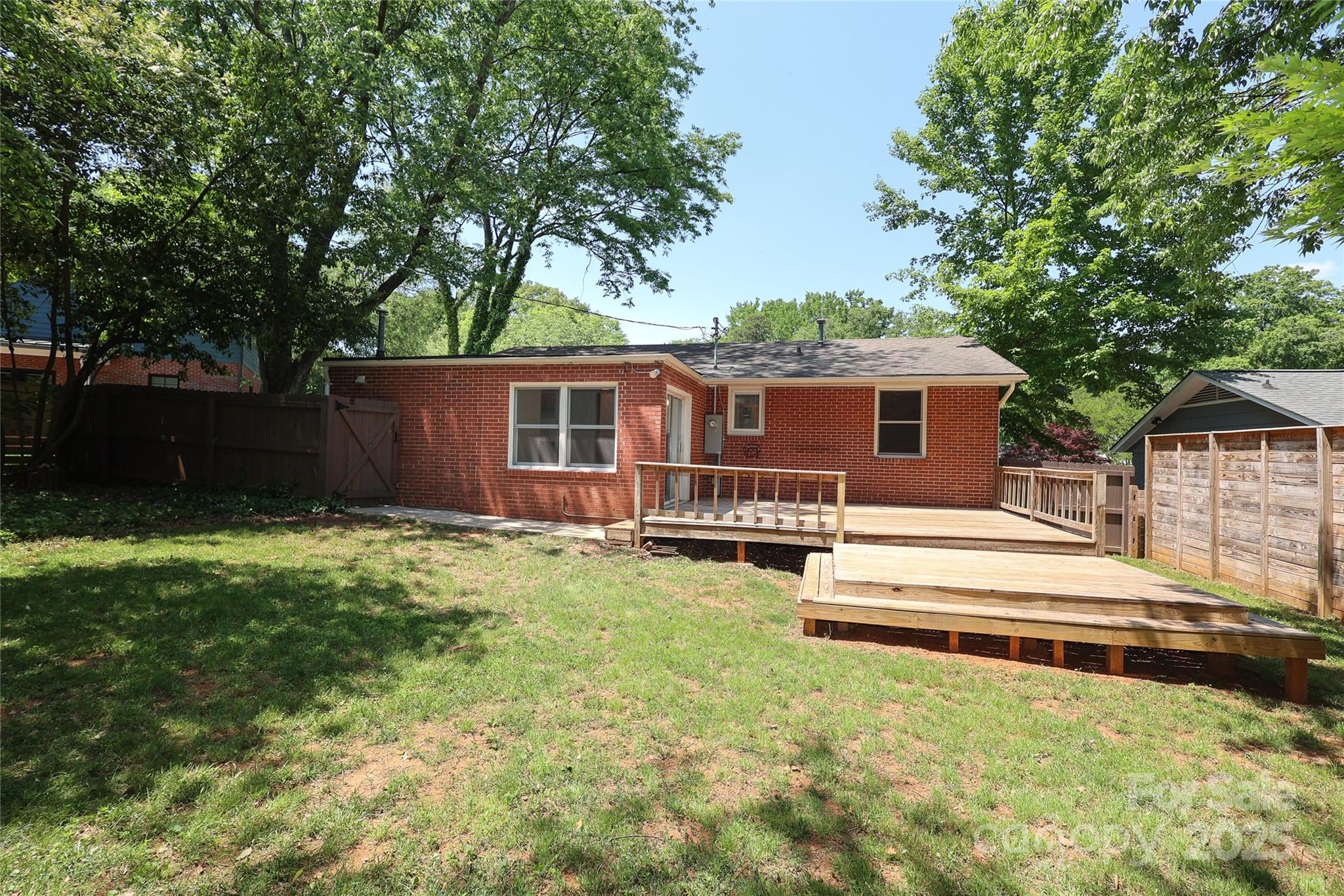 4361 Applegate Road Charlotte, NC 28209 - Photo 17 of 17 a view of a house with backyard and sitting area