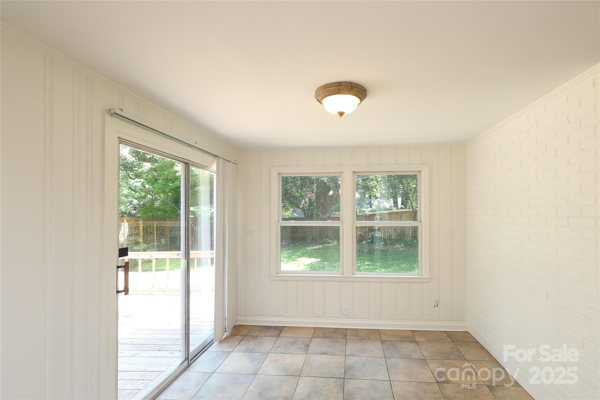 4361 Applegate Road Charlotte, NC 28209 - Photo 8 of 17 a view of an empty room with a window
