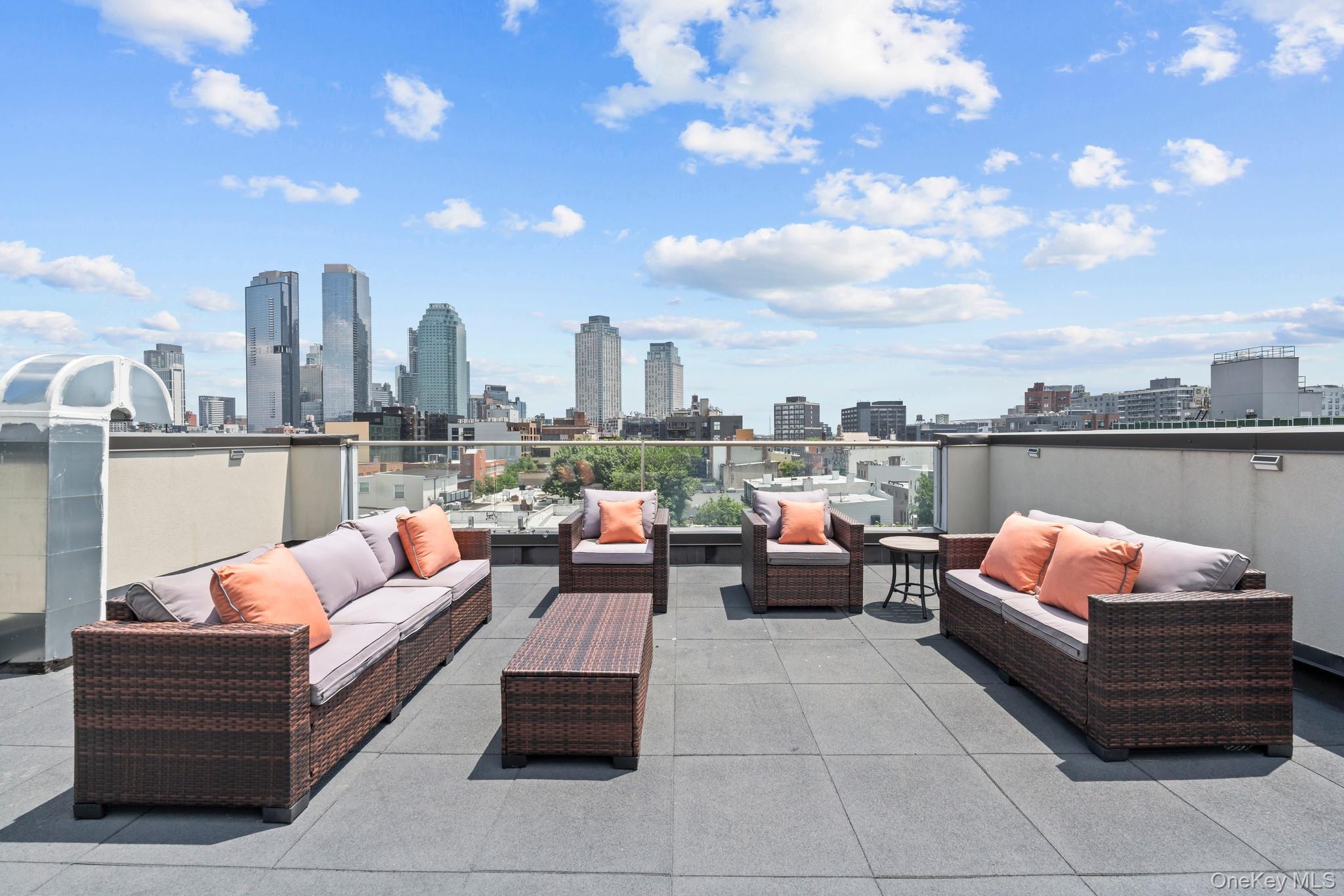 46-40 Vernon Boulevard, Unit 3B Queens, NY 11101 - Photo 13 of 17 View of patio with a view of skyline