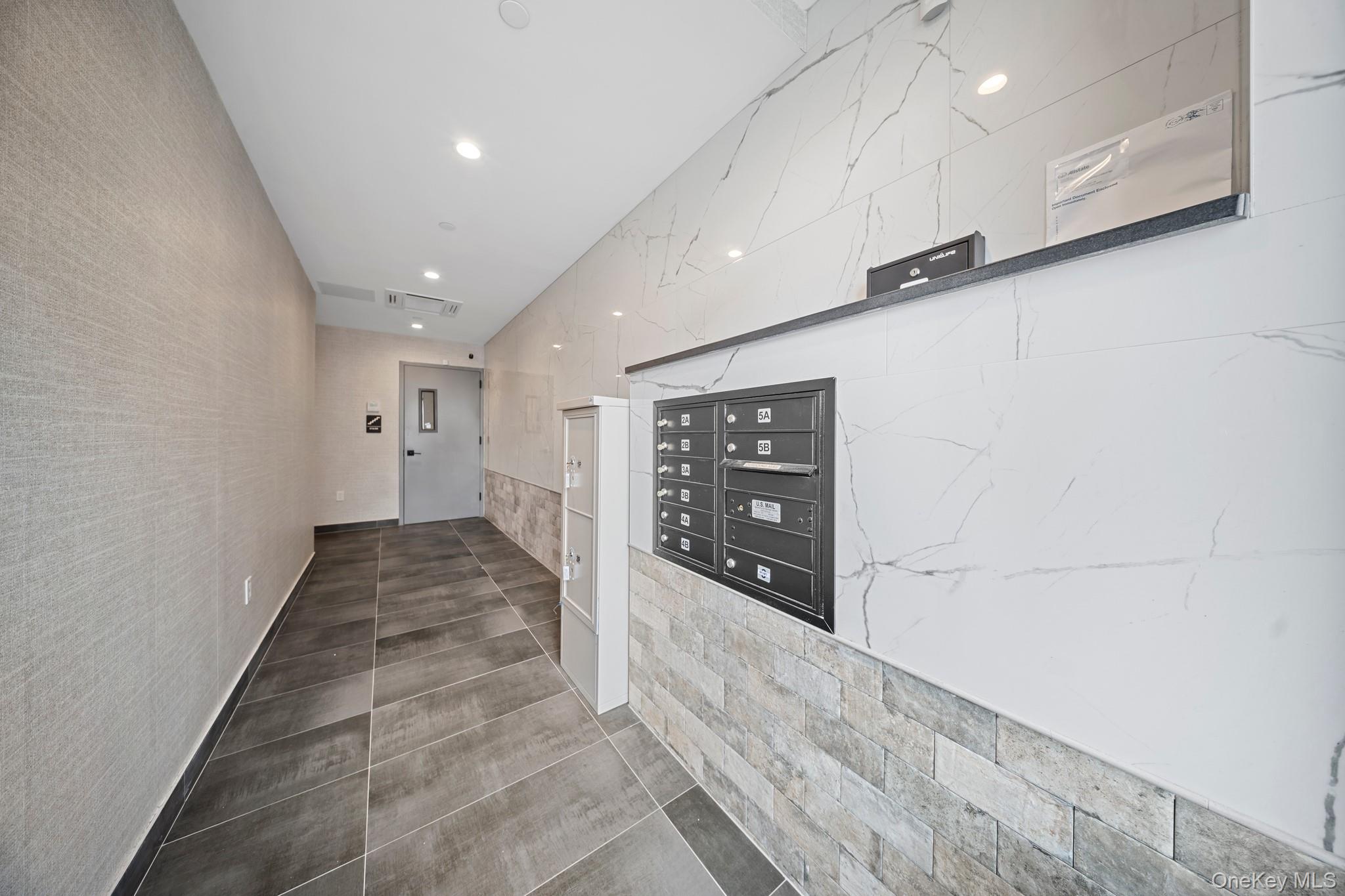 46-40 Vernon Boulevard, Unit 3B Queens, NY 11101 - Photo 15 of 17 Hall featuring tile patterned floors and recessed lighting