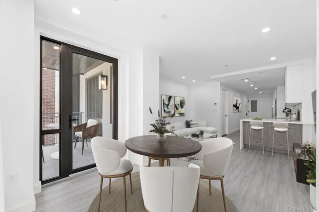 a dining room with furniture and wooden floor
