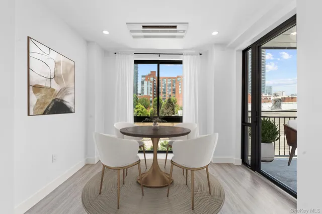 a view of a dining room with furniture window and outside view