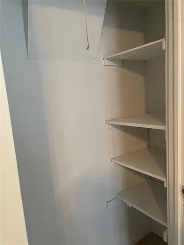 a view of an empty walk in closet