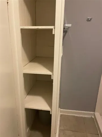 a utility room with washing machine