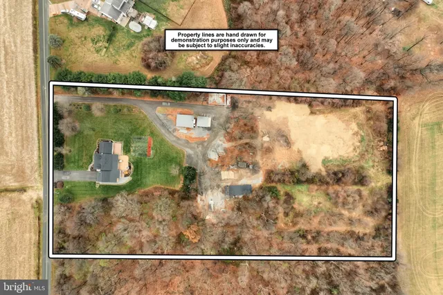 a kitchen with stainless steel appliances granite countertop a refrigerator a stove a sink and a microwave