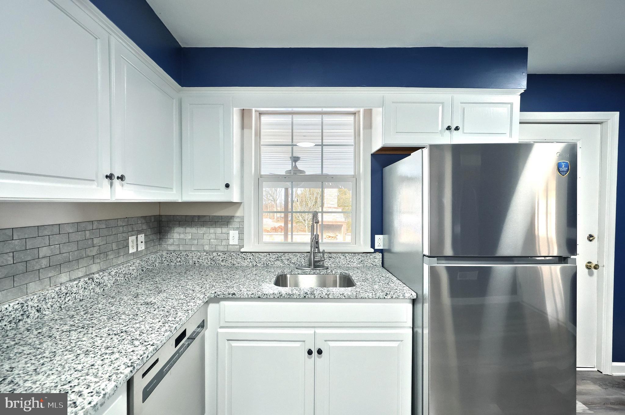 5077 Snyder Mill Road Spring Grove, PA 17362 - Photo 17 of 71 a kitchen with stainless steel appliances granite countertop a refrigerator and a sink