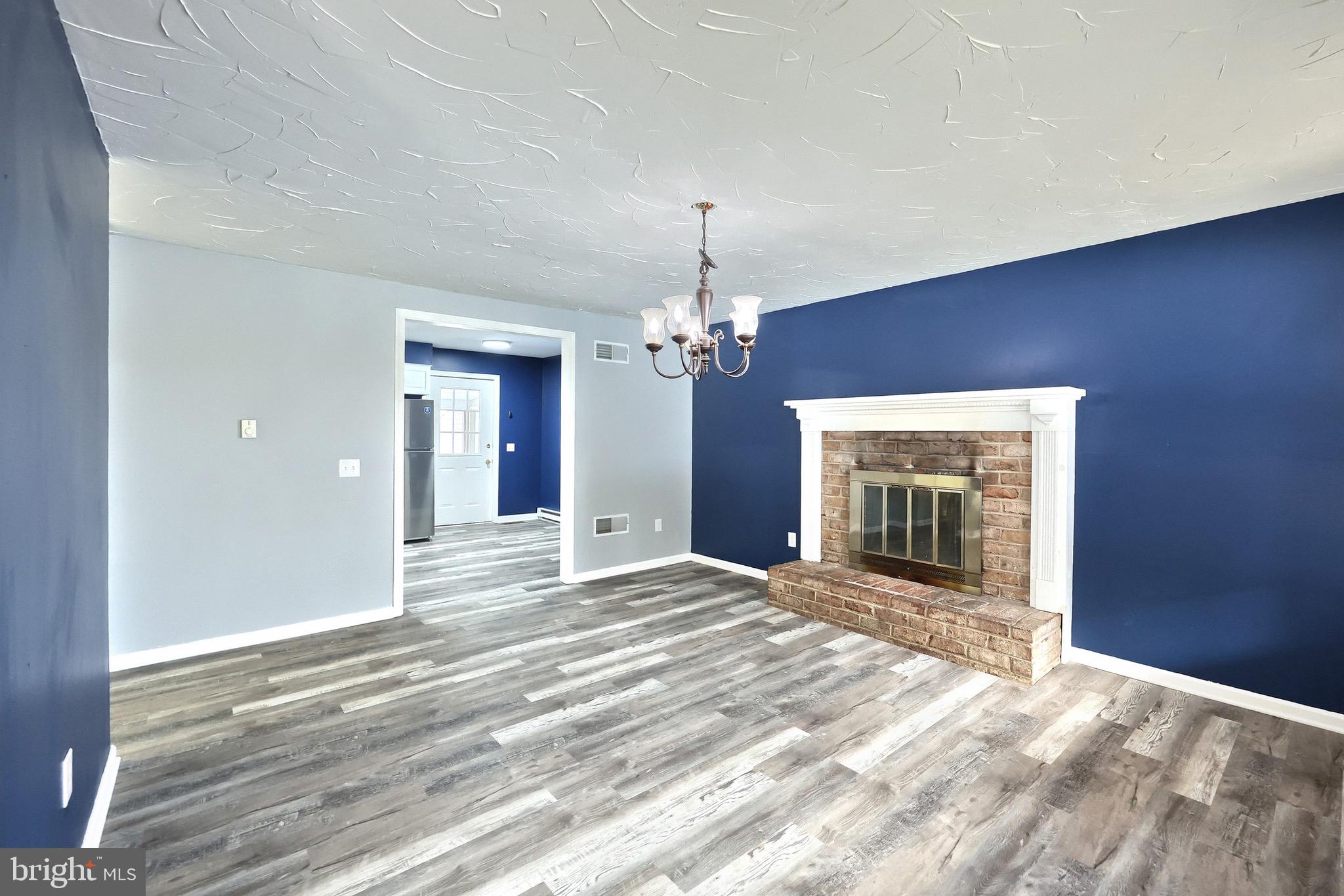 5077 Snyder Mill Road Spring Grove, PA 17362 - Photo 19 of 71 a view of an empty room with a fireplace