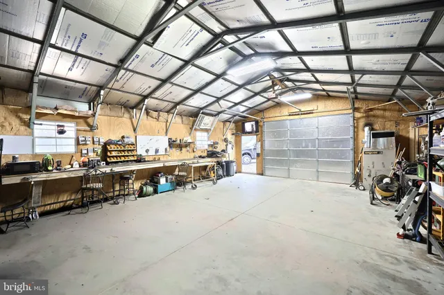 a bathroom with a sink and mirror with bathtub