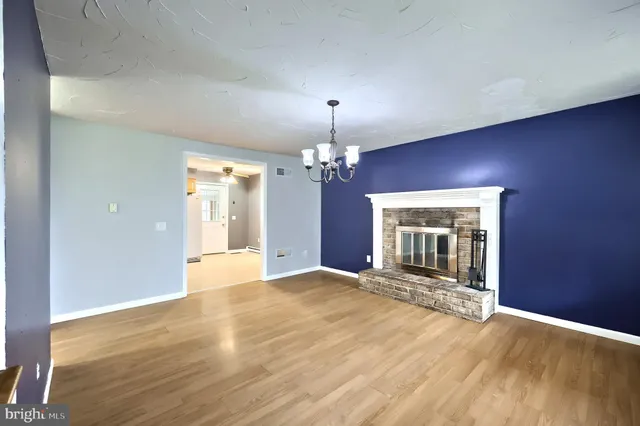 a aerial view of a house with swimming pool and a yard
