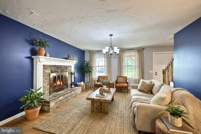 a front view of a house with a yard table and chairs