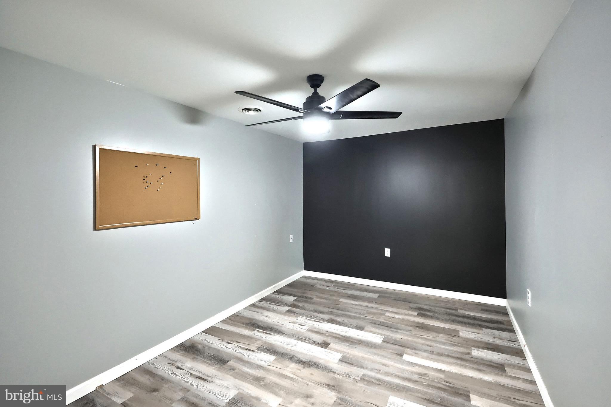 5077 Snyder Mill Road Spring Grove, PA 17362 - Photo 44 of 71 a view of a big room with a ceiling fan and a window