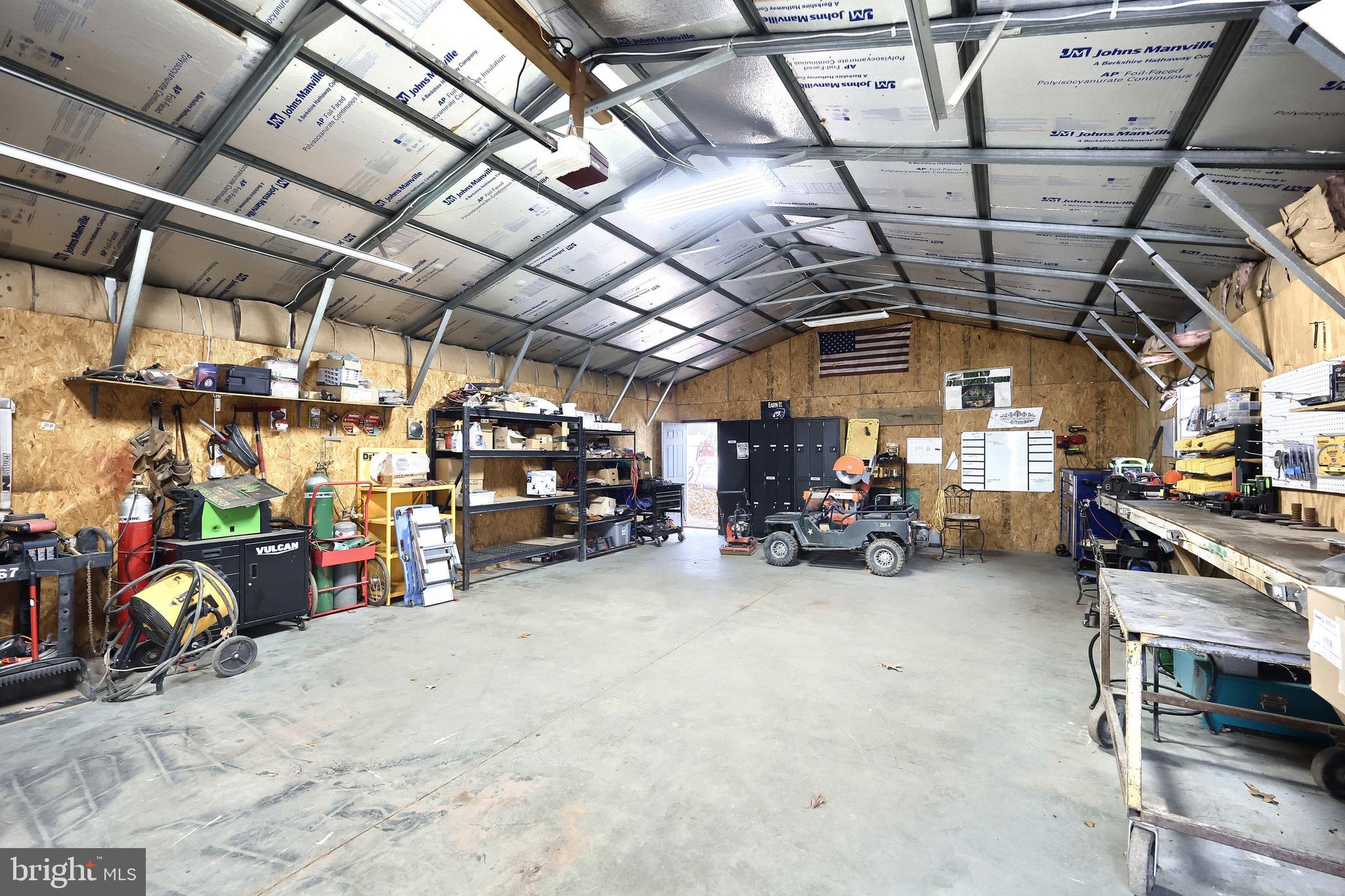 5077 Snyder Mill Road Spring Grove, PA 17362 - Photo 49 of 71 a view of a garage with parked cars