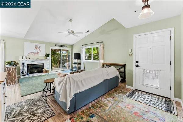 a spacious bedroom with a balcony a bed and a fireplace