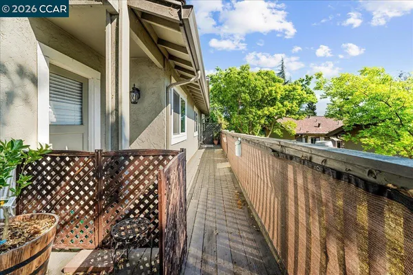 a view of balcony with wooden floor