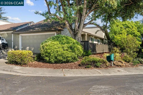 front view of a house with a garden