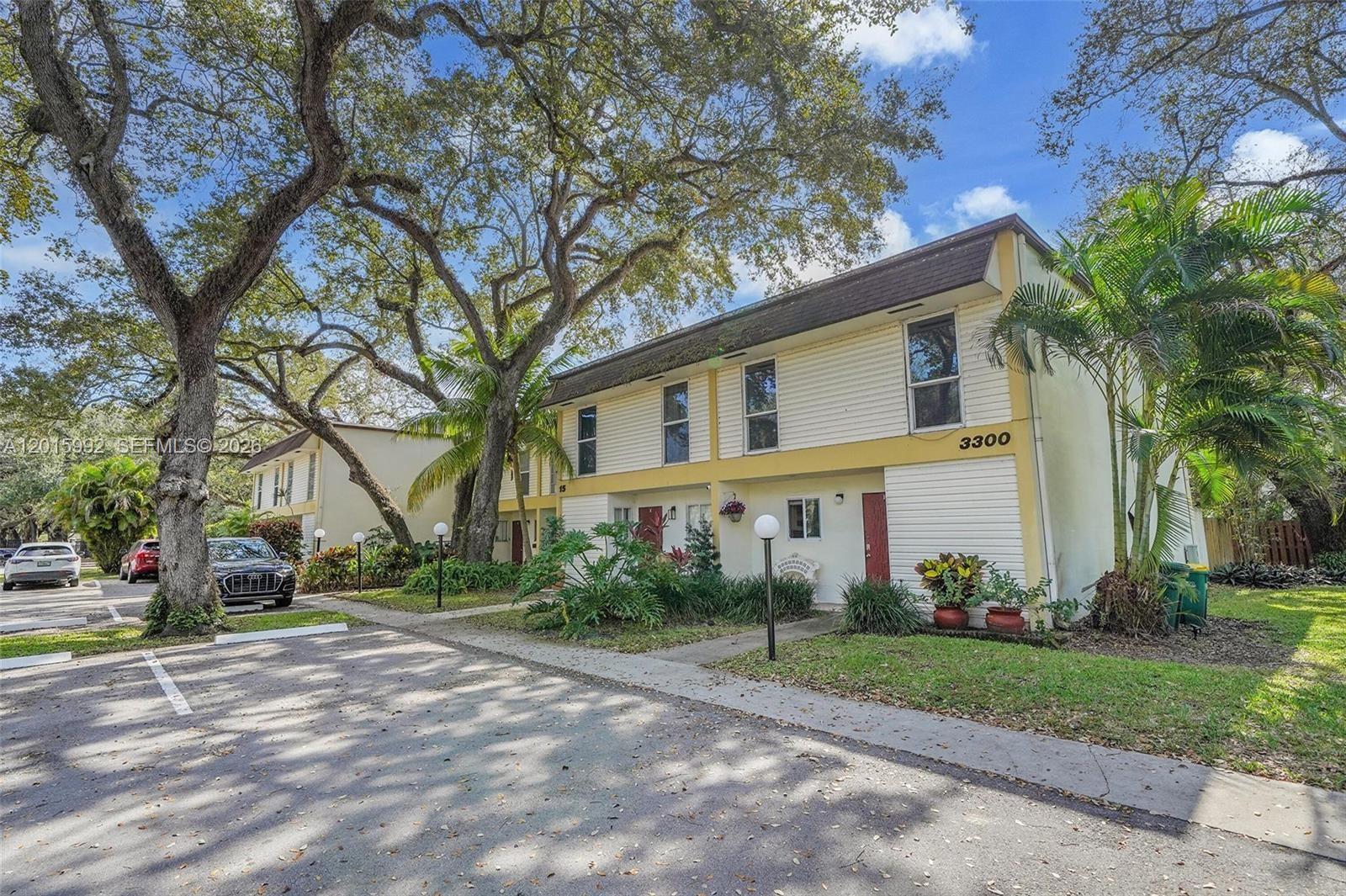 3300 Atlanta Street, Unit 15F Hollywood, FL 33021 - Photo 2 of 30 a view of road with large trees