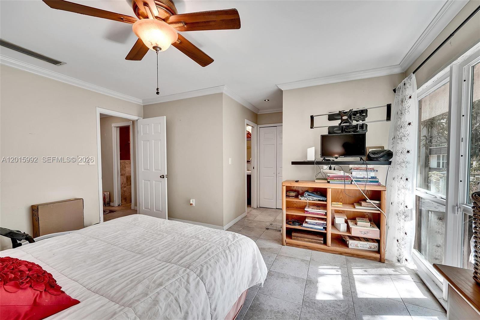 3300 Atlanta Street, Unit 15F Hollywood, FL 33021 - Photo 22 of 30 a bedroom with a bed and a tv