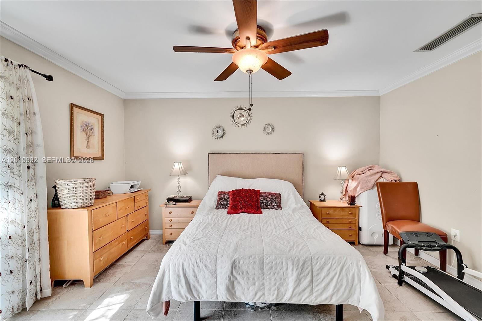 3300 Atlanta Street, Unit 15F Hollywood, FL 33021 - Photo 23 of 30 a bedroom with a bed a chair and potted plant