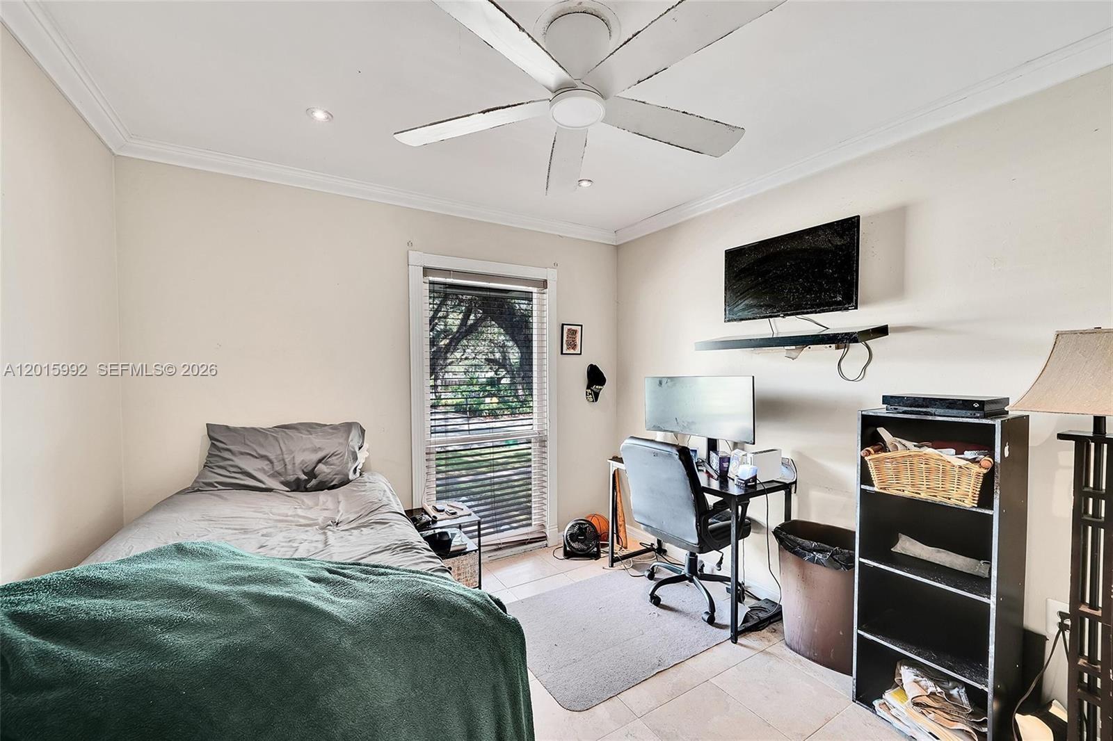 3300 Atlanta Street, Unit 15F Hollywood, FL 33021 - Photo 25 of 30 a bedroom with furniture and a flat screen tv