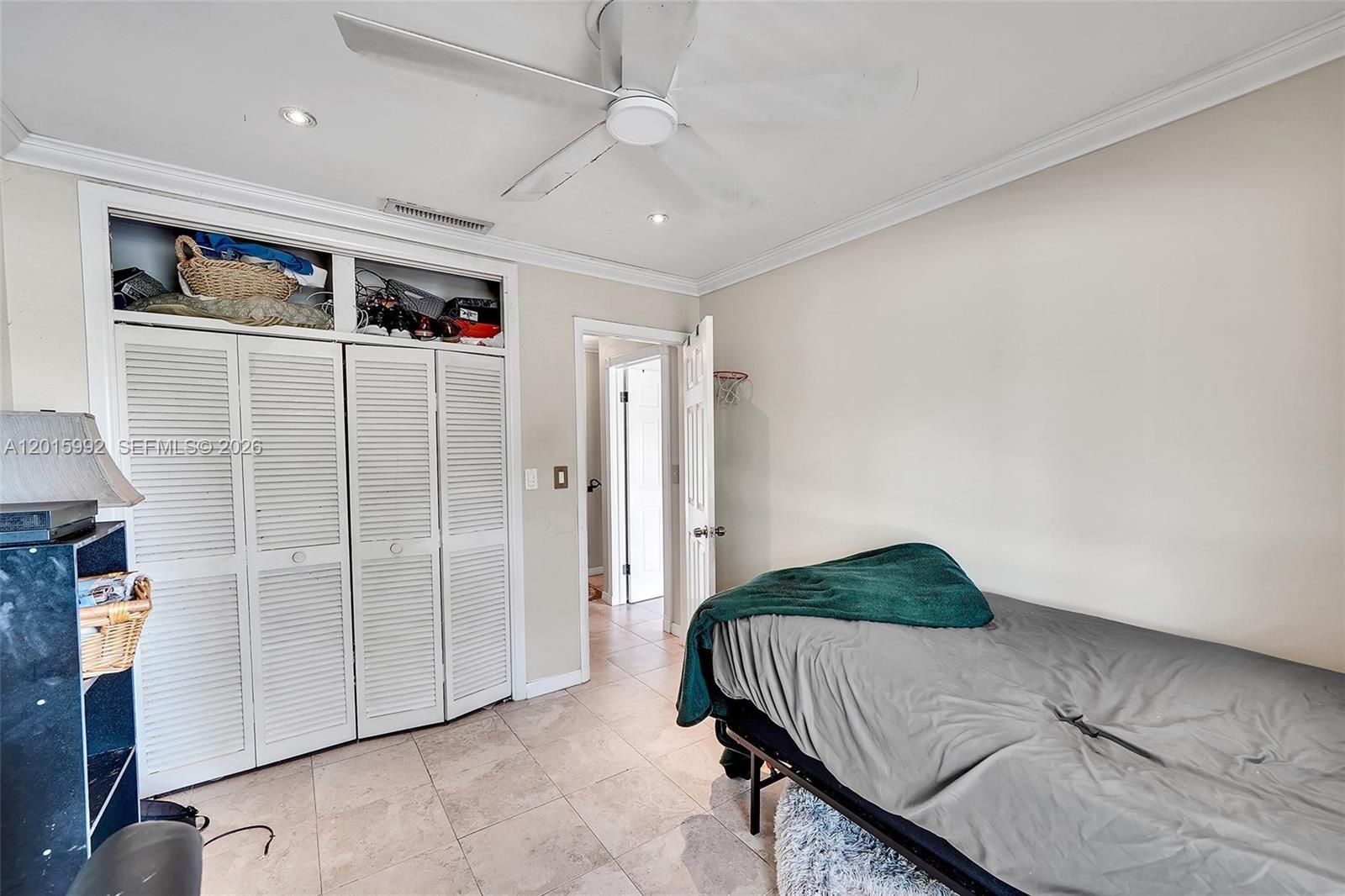 3300 Atlanta Street, Unit 15F Hollywood, FL 33021 - Photo 26 of 30 a bedroom with a bed and a shower