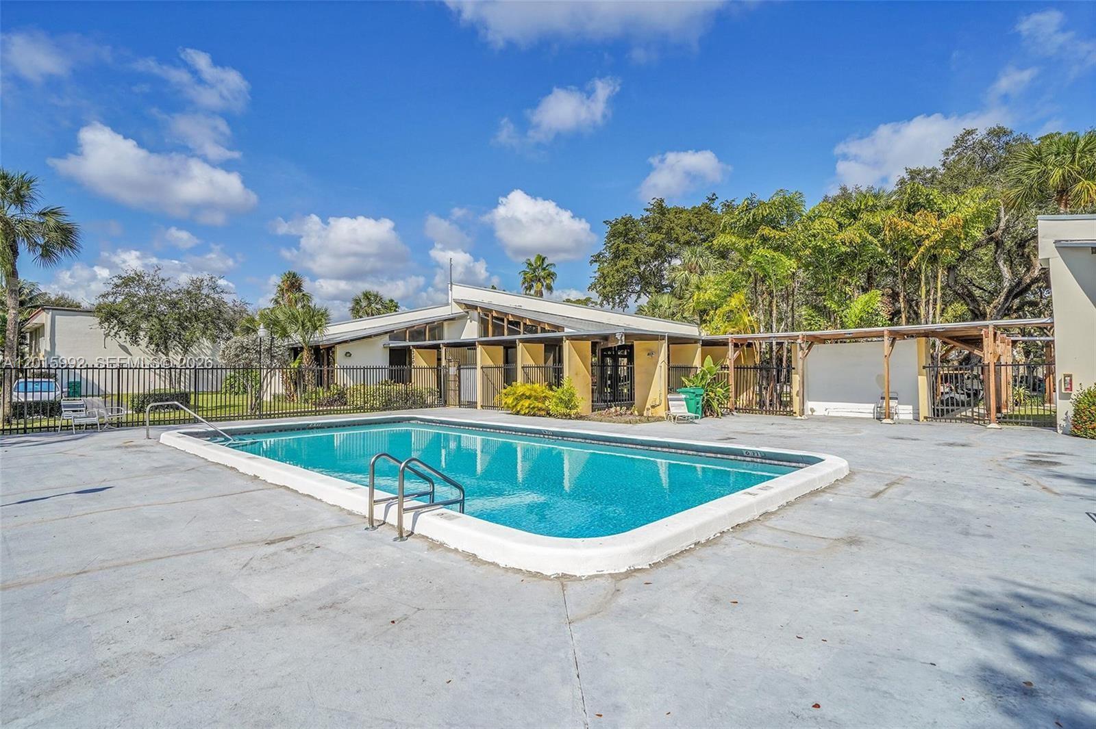 3300 Atlanta Street, Unit 15F Hollywood, FL 33021 - Photo 29 of 30 a view of a swimming pool with a patio