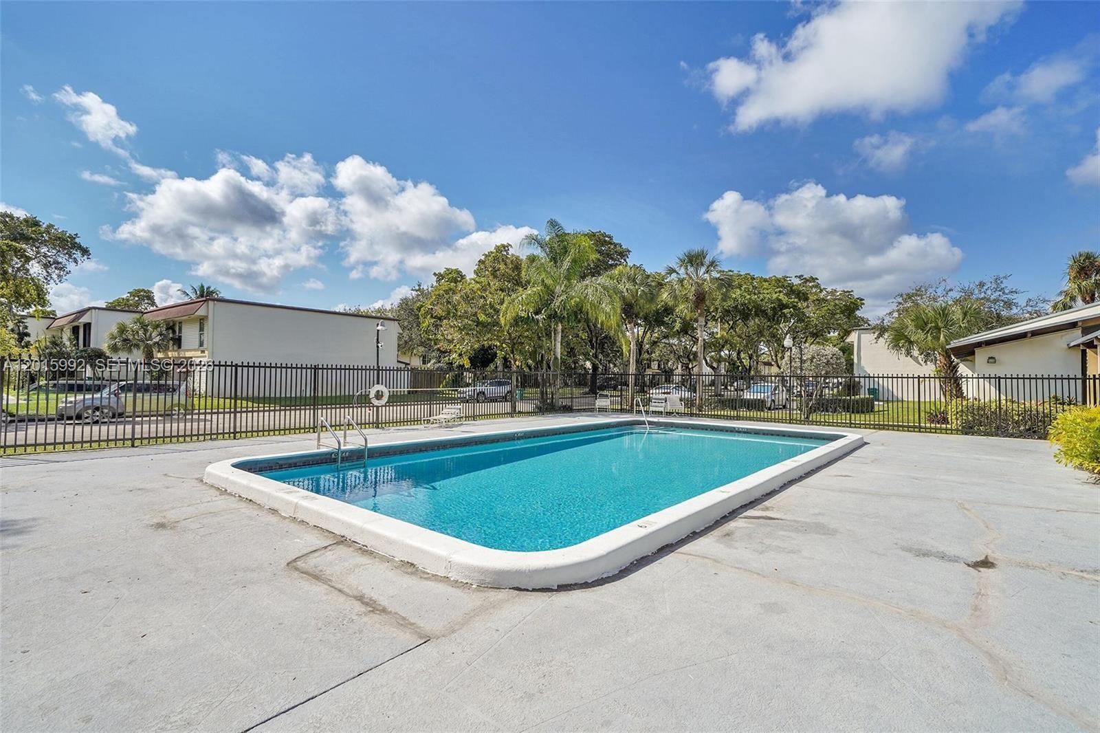 3300 Atlanta Street, Unit 15F Hollywood, FL 33021 - Photo 30 of 30 a view of outdoor space and swimming pool