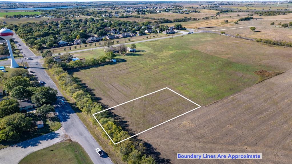 Lot 4-tbd Th Street Muenster, TX 76252 - Photo 4 of 6 an aerial view of residential houses with outdoor space