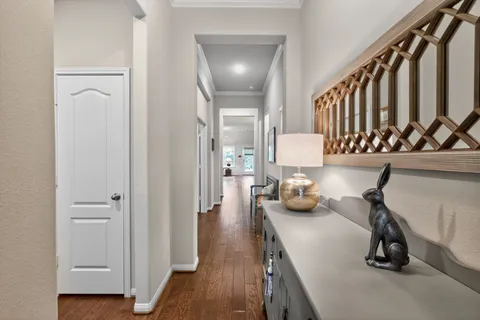 a view of a room with wooden floor and windows