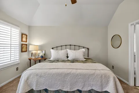 a bedroom with a bed and window