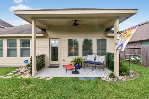 a house view with a seating space and garden
