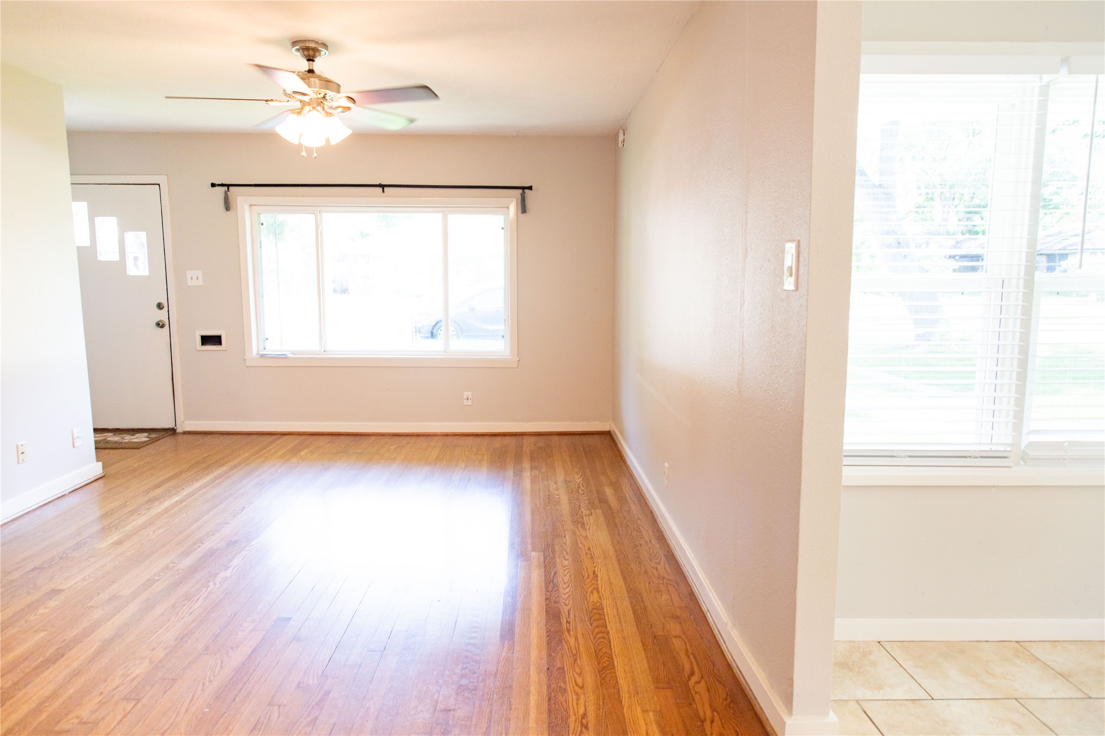 3314 Rochdale Street Houston, TX 77025 - Photo 11 of 29 a view of an empty room with wooden floor and a window
