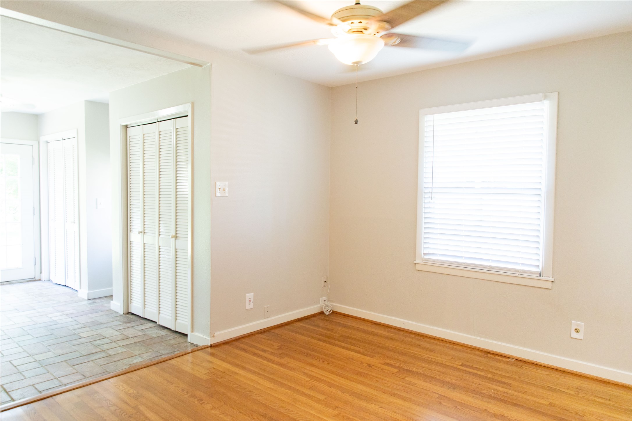 3314 Rochdale Street Houston, TX 77025 - Photo 13 of 29 a view of an empty room with wooden floor and a window
