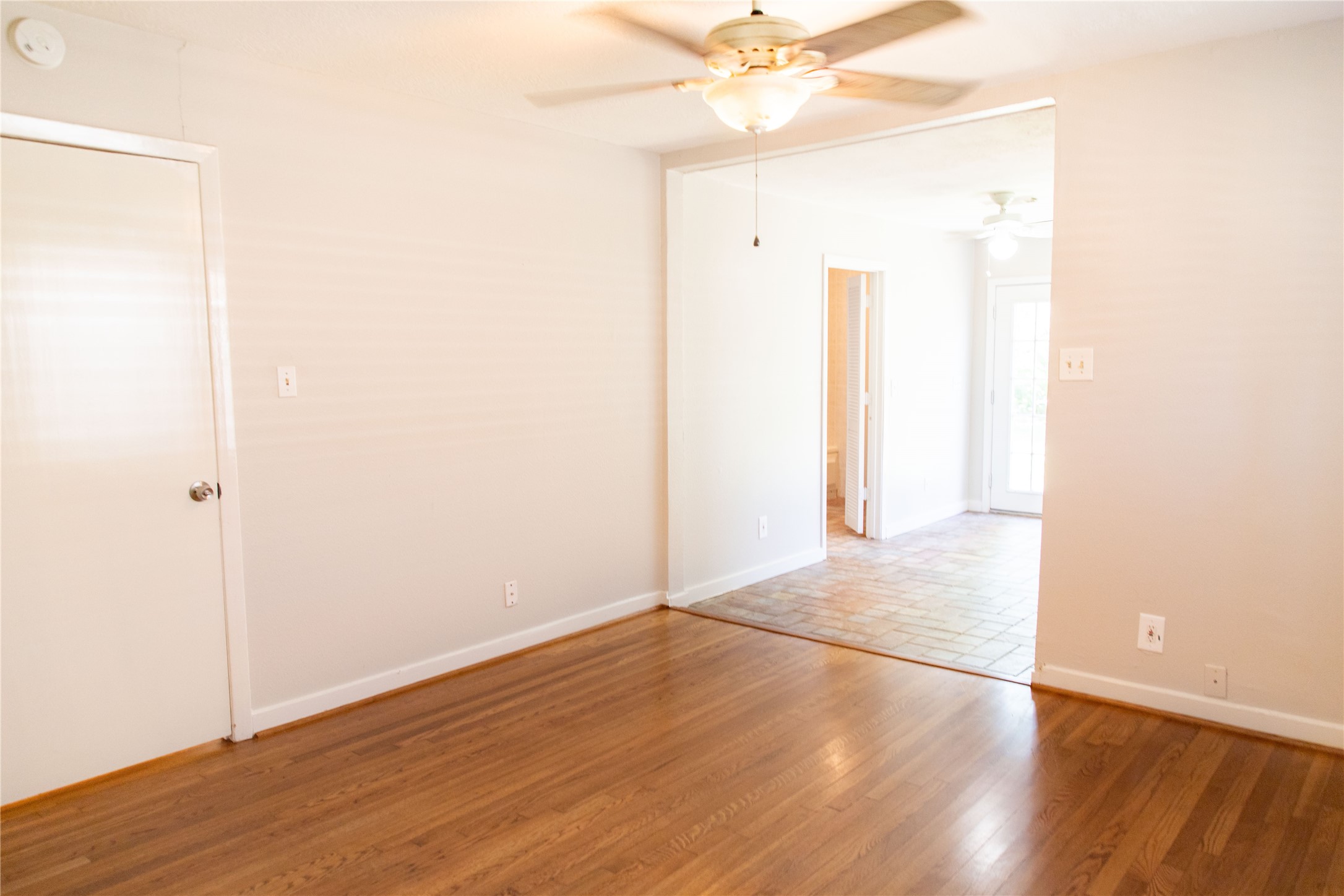 3314 Rochdale Street Houston, TX 77025 - Photo 14 of 29 an empty room with wooden floor and fan