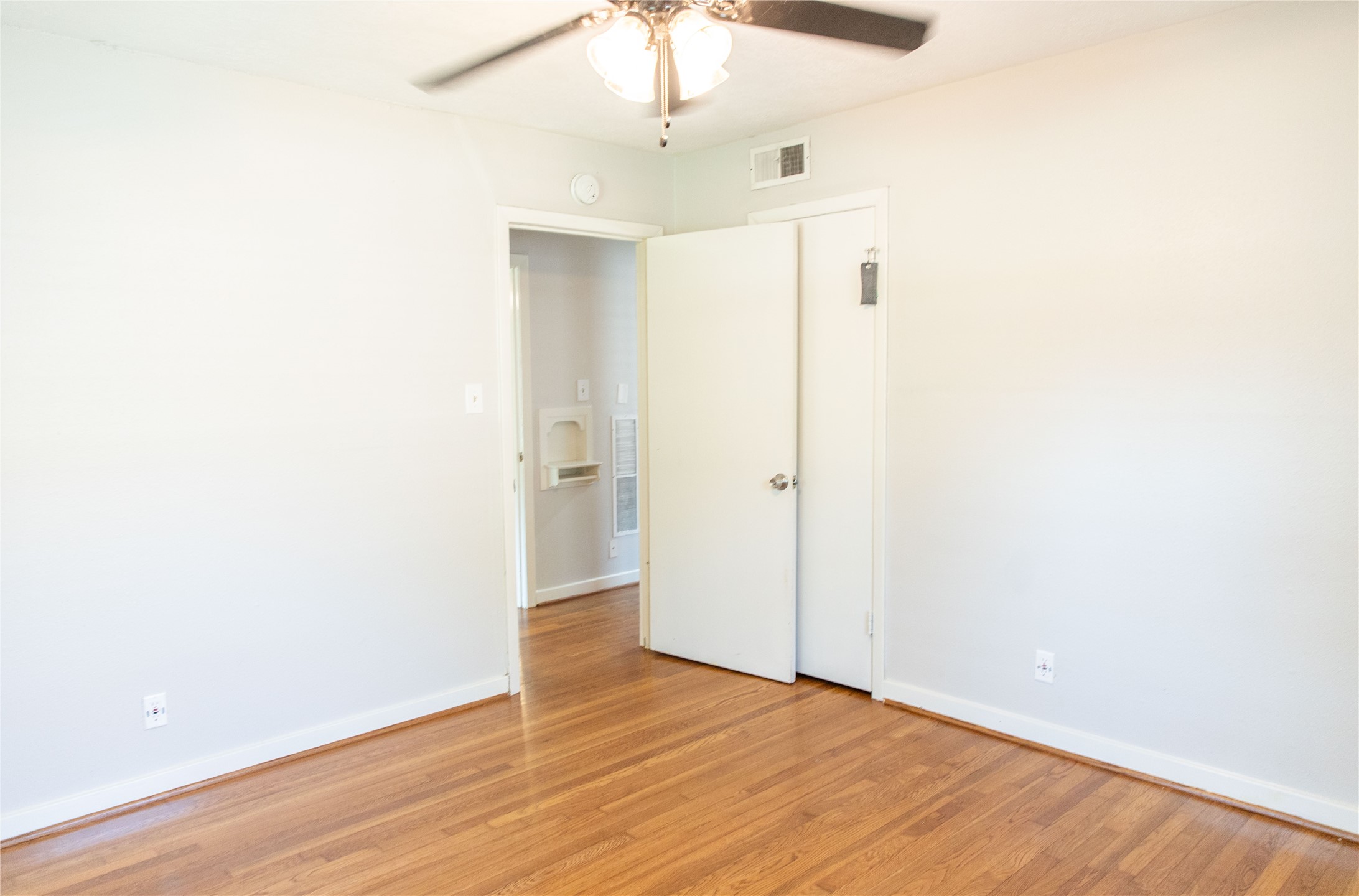 3314 Rochdale Street Houston, TX 77025 - Photo 23 of 29 a view of an empty room with wooden floor