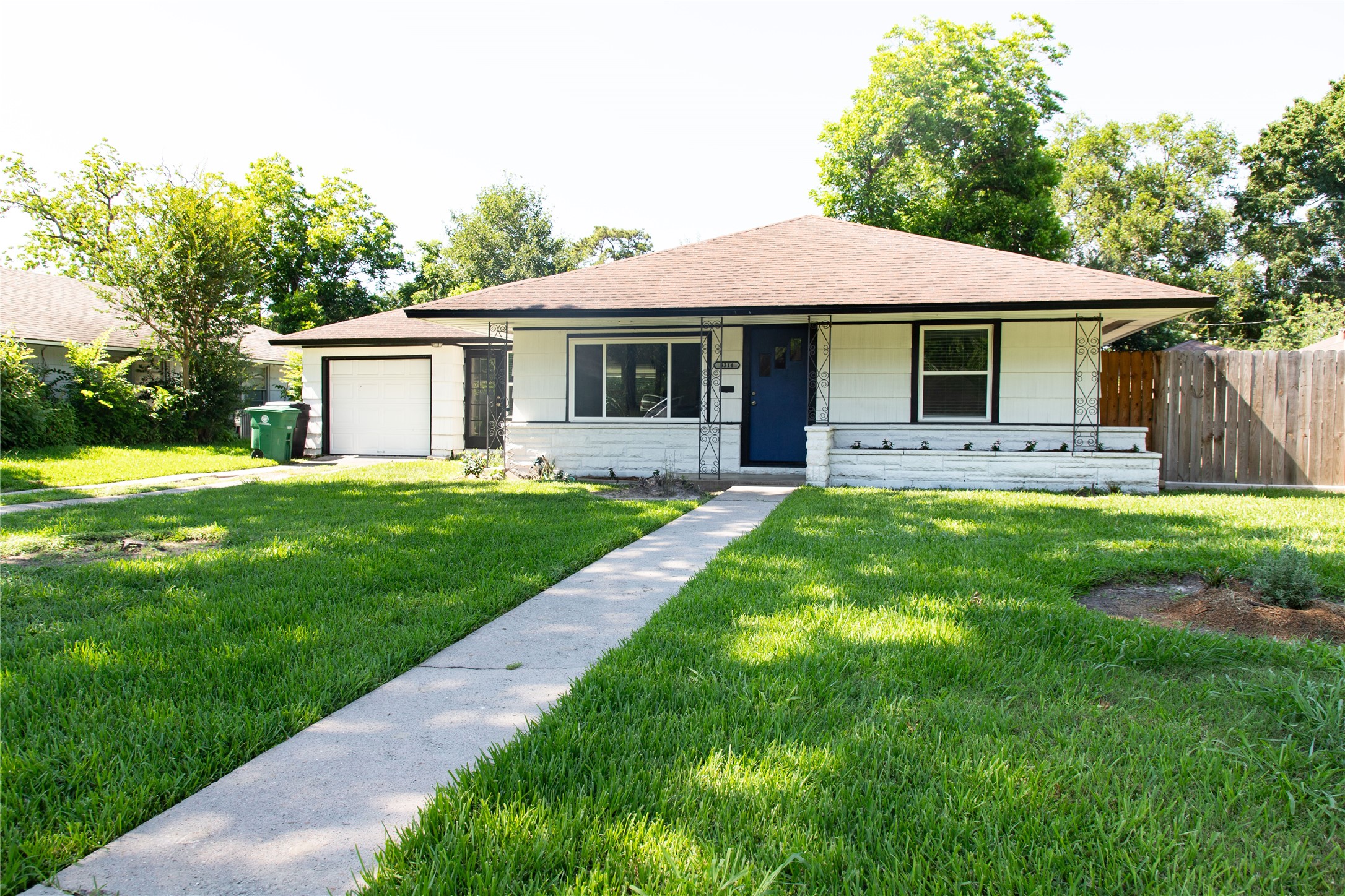 3314 Rochdale Street Houston, TX 77025 - Photo 3 of 29 a front view of a house with a yard and porch