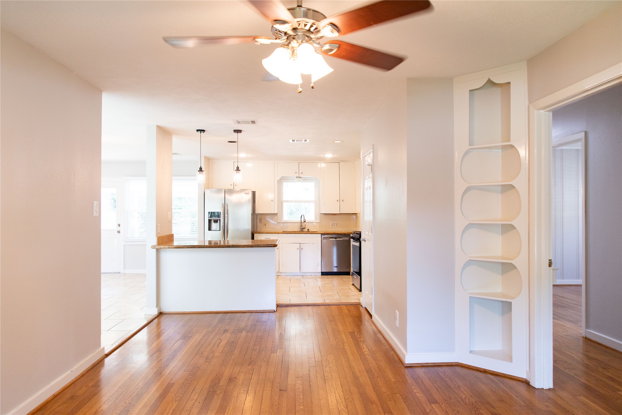 3314 Rochdale Street Houston, TX 77025 - Photo 8 of 29 a kitchen with kitchen island white cabinets and stainless steel appliances