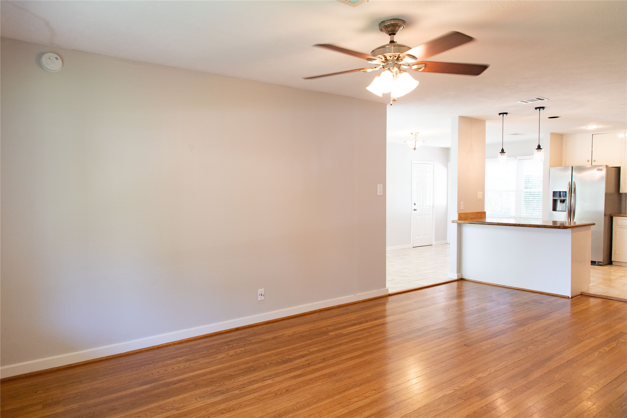 3314 Rochdale Street Houston, TX 77025 - Photo 9 of 29 a view of an empty room with wooden floor