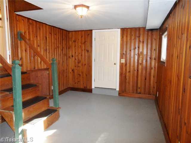 6804 Ivy Lane Oak Ridge, NC 27310 - Photo 14 of 16 Bonus. The Bonus room in the basement is heated and cooled. Whatever your overflow is, the space is here.