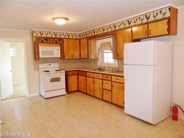 6804 Ivy Lane Oak Ridge, NC 27310 - Photo 8 of 16 Kitchen. Take another look at just how spacious this kitchen is!