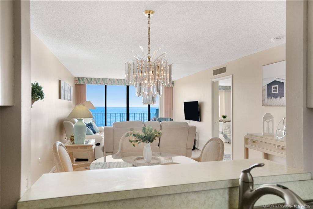 3200 North Hwy A1A, Unit 805 Fort Pierce, FL 34949 - Photo 14 of 43 a dining room with furniture and window