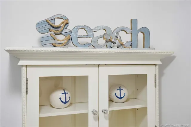 a living room with furniture a rug and a flat screen tv