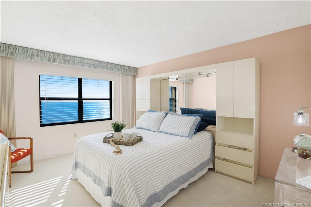 3200 North Hwy A1A, Unit 805 Fort Pierce, FL 34949 - Photo 22 of 43 a bedroom with a bed and a window