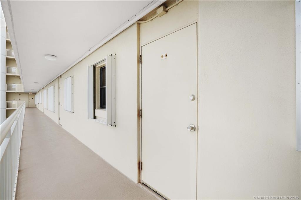 3200 North Hwy A1A, Unit 805 Fort Pierce, FL 34949 - Photo 31 of 43 a view of a hallway with staircase