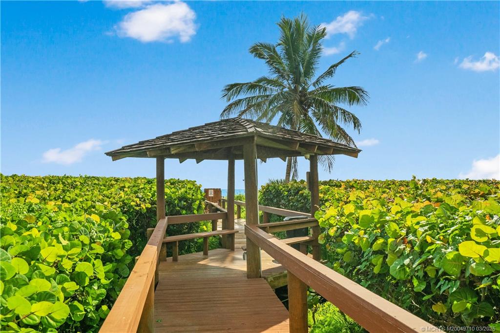 3200 North Hwy A1A, Unit 805 Fort Pierce, FL 34949 - Photo 34 of 43 a view of a chair and tables front of the house